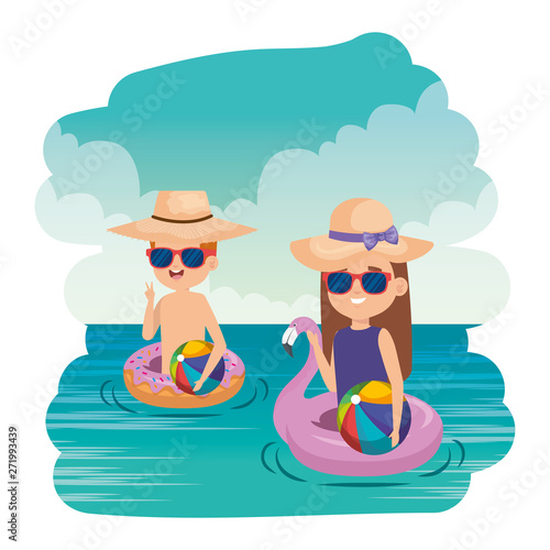 little kids couple with floats and balloons in the sea