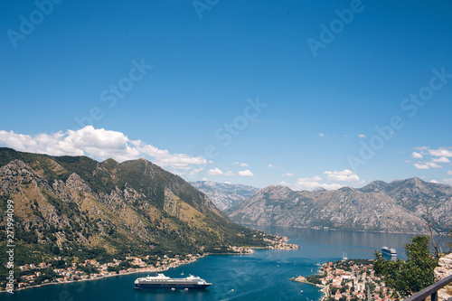 Montenegro Adriatic Sea and mountains. Picturesque panorama of the city of Kotor on a summer day. Panoramic view of the Bay of Kotor and the city. Cruise liner in the Bay of Kotor