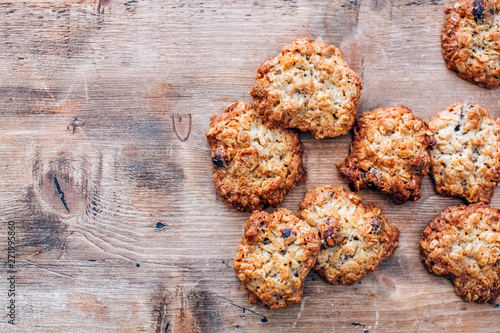 Cookies on a rustic wooden table. Homemade cookies with nuts and dried fruit. Top view flat lay background. Space for text. cookies on wooden table background