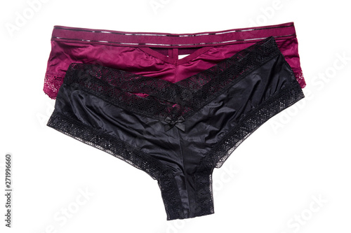 Underwear woman isolated. Close-up of luxurious elegant black and a pink satin lacy thongs panties isolated on a white background. Underwear fashion.