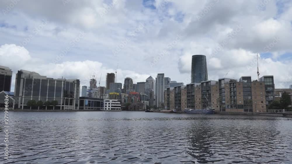 A cityscape on a riverside with beautiful clouds in the sky. A cityscape on a riverside with beautiful clouds in the sky.