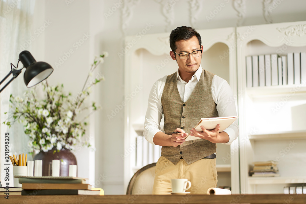 young asian designer working at home young asian designer working at home
