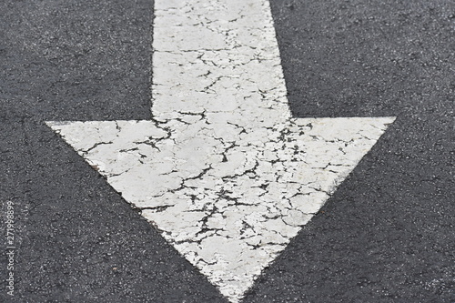 White cracked Arrow on Road