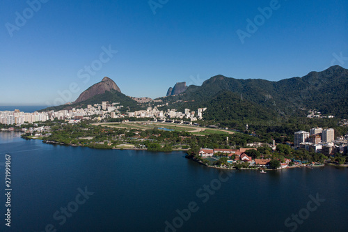 Aerial view from the city lake Lagoa Rodrigo de Freitas in Rio de Janeiro with the jockey horse racing field in the foreground and the Two Brothers mountain and mountain range in the background