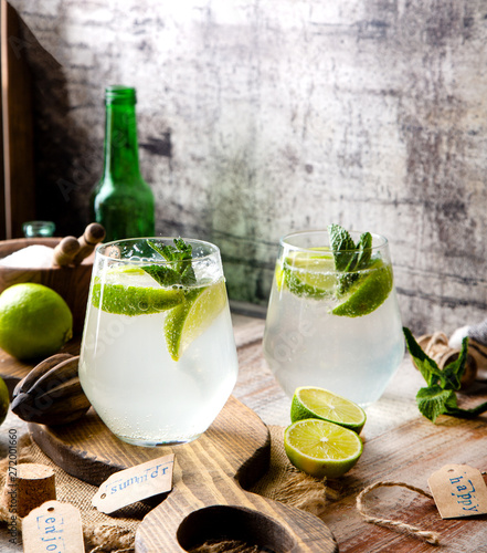 Wallpaper Mural Two glasses of cold icy summer cocktail mojito with mint leaves and slices of lime Torontodigital.ca