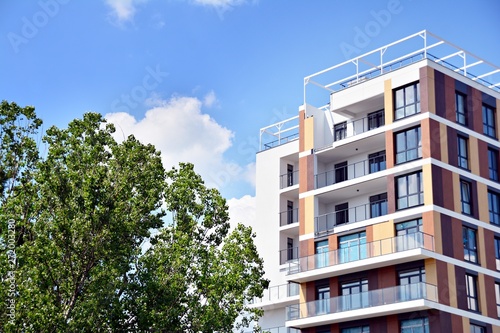 Modern apartment buildings on a sunny day with a blue sky. Facade of a modern apartment building