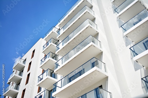 Modern apartment buildings on a sunny day with a blue sky. Facade of a modern apartment building