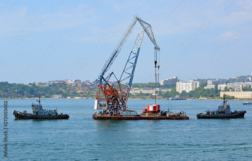 Installation of buoys denoting the parking of ships in the port water area in Sevastopol