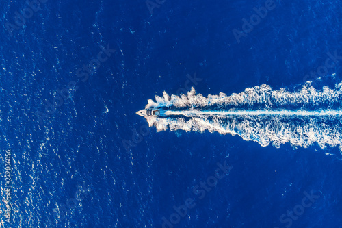 Luxury private speed motor boat. Aerial top view © Parilov