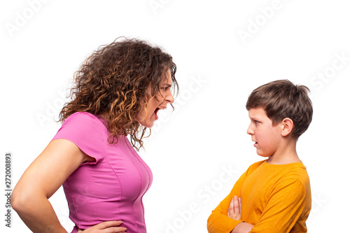 Mom scolds the son of a teenager, she emotionally screams at him.  Son dissatisfied with the charges.  The problem of parents and children. photo