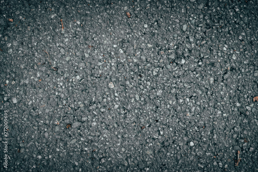 Grey background of a gravel road with a rough texture - Close-up shot of tiny pebbles floor with a chopped surface Grey background of a gravel road with a rough texture - Close-up shot of tiny pebbles floor with a chopped surface