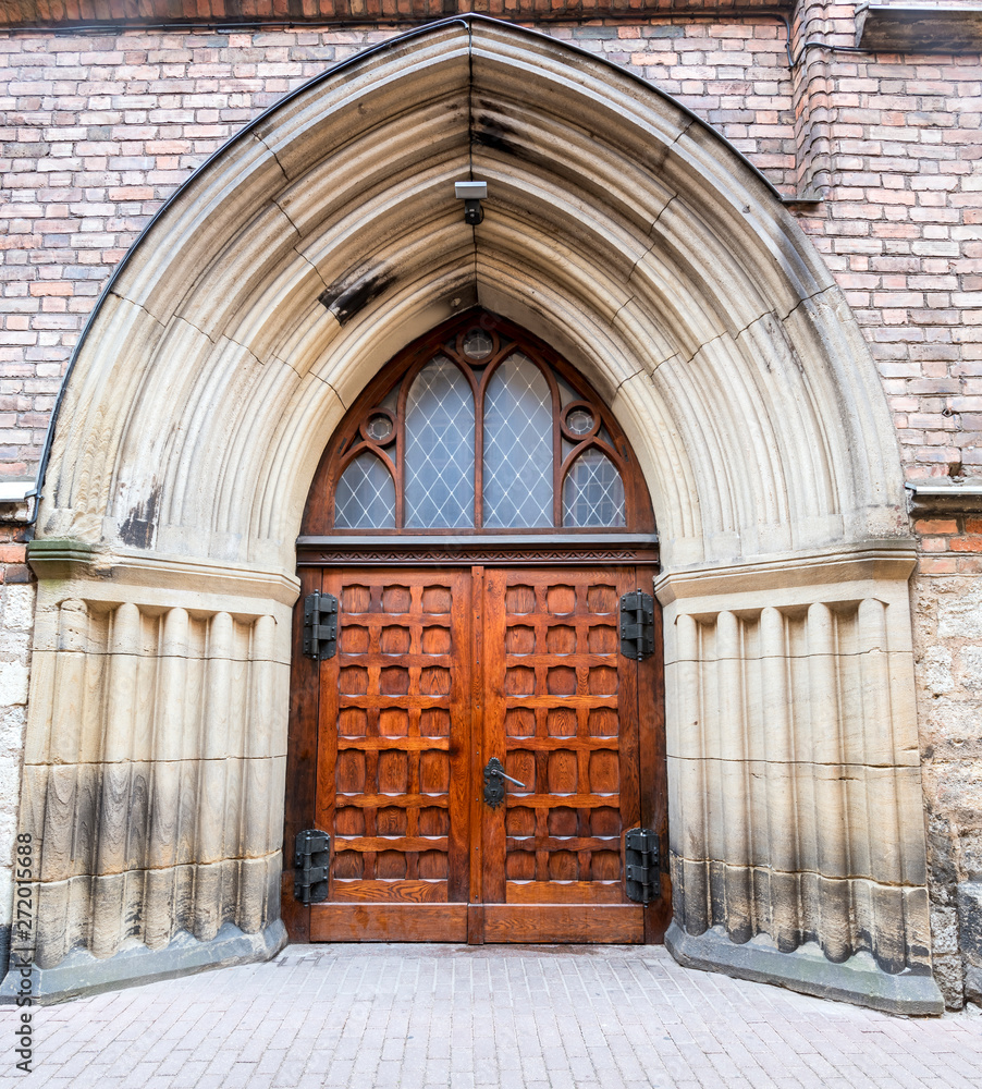 Fototapeta premium Entrance to the medieval church Latvia, Europe