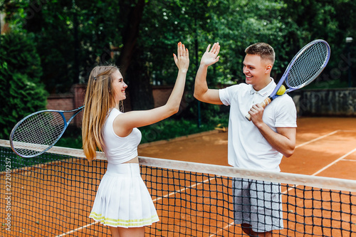 Couple handshaking at the tennis court after playing a game.. © Тарас Нагирняк