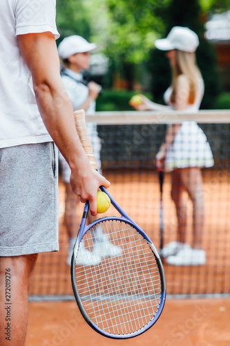 A tennis player  man prepares to serve a tennis ball during a match.. © Тарас Нагирняк