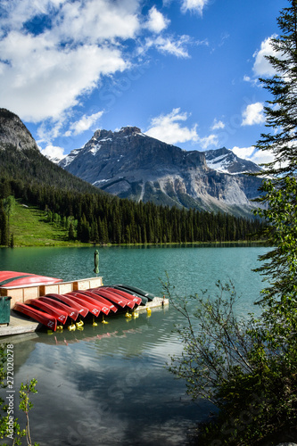 Canoes on a dock at the Beautiful Emerald lake in Yoho National Park, Banff Canada © Levi