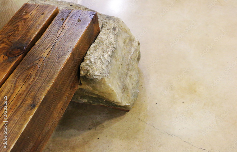 Massive wooden bench on a granite floor Massive wooden bench on a granite floor