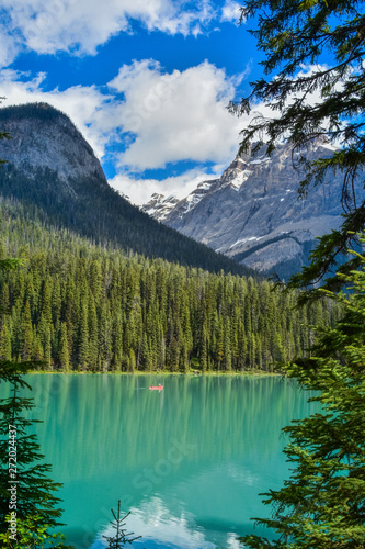 Canoes and Kayaks frequent the Beautiful Emerald lake in Yoho National Park  Banff Canada