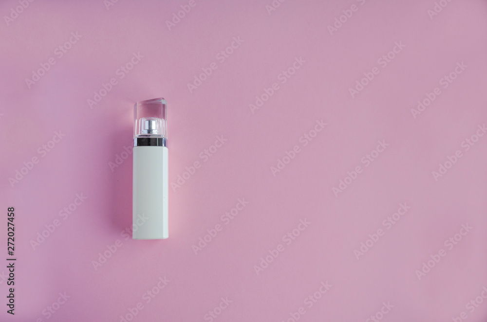 White bottle of perfume on a pink background. soft focus. copy space. White bottle of perfume on a pink background. soft focus. copy space.
