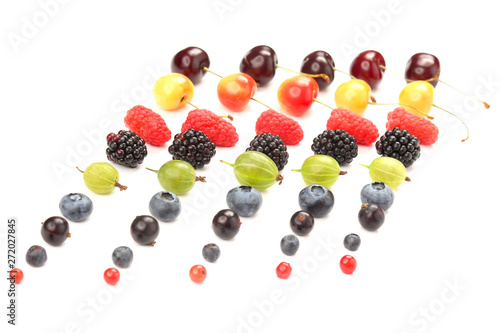 different juicy berries are laid out in rows on a white background