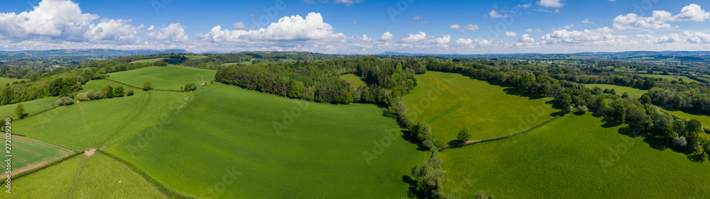 Aerial panoramic view of typical british farmers fields and some sheep, captured near Usk in South Wales, UK Aerial panoramic view of typical british farmers fields and some sheep, captured near Usk in South Wales, UK