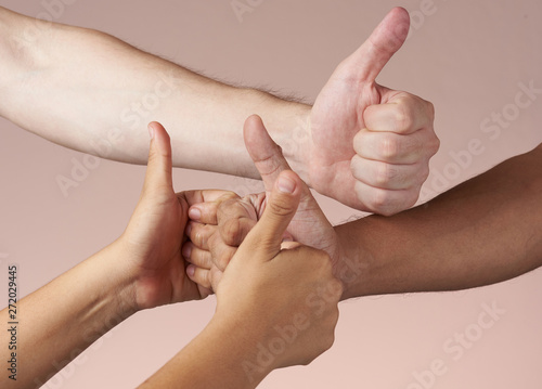 Various hands with thumbs-up