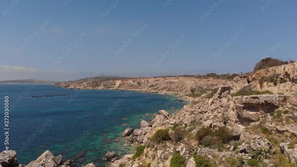 AERIAL: Beautiful landscape along the rocky coastline of mediterranean island AERIAL: Beautiful landscape along the rocky coastline of mediterranean island