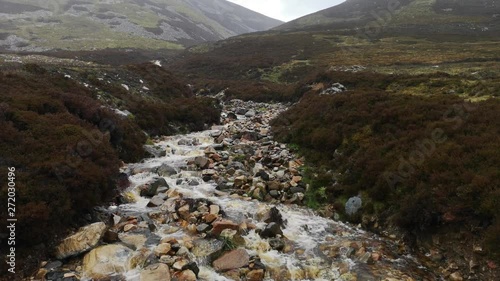 Scotland river in nature with strong current and strong rain weather photo