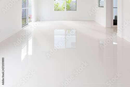 White tile floor background in perspective view. Clean, shiny, symmetry with grid line texture. For decoration in bathroom, kitchen and laundry room. And empty or copy space for product display also. photo