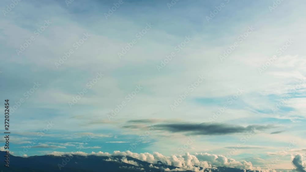 Timelapse of cloud formation over the mountains in the distance, blue sky, peaceful scenery. Timelapse of cloud formation over the mountains in the distance, blue sky, peaceful scenery.