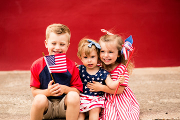 Cute Kids holding mini American flags