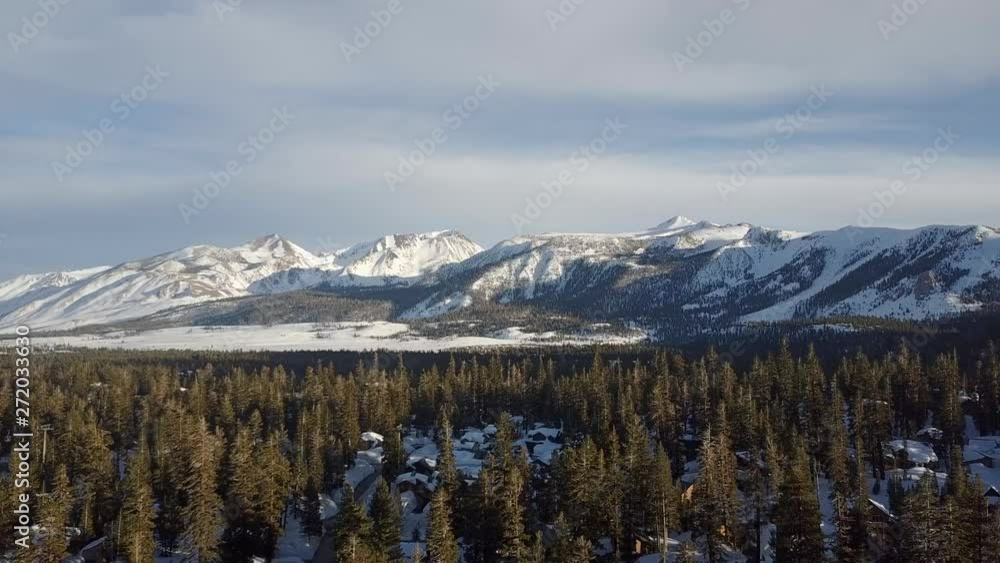 Aerial Sunset over Snow Covered Mountains Aerial Sunset over Snow Covered Mountains