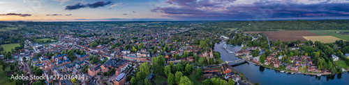 Dramatic aerial panoramic view of the beautiful town of Marlow in Buckinghamshire UK, captured after a rain storm at dusk photo