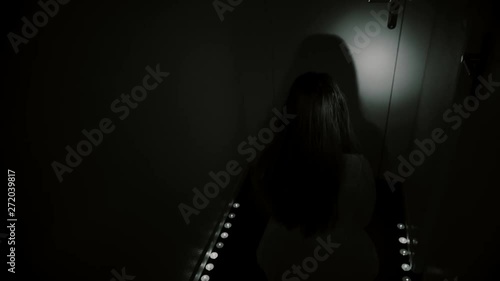 Creepy POV nightmare. A man enters dark hallway and encounters a monster with candles. Exorcism, ghost or evil apparition.