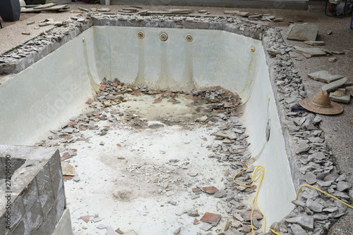 Empty swimming pool after demolishing old tile and coping for remodel
