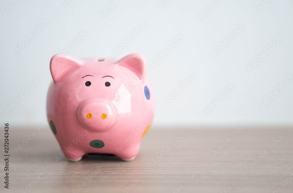 Pink ceramic piggy bank on white background, saving money concept Pink ceramic piggy bank on white background, saving money concept