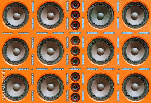 Multiple Rows of Sound Speakers, Led Light Strips on Orange Background.