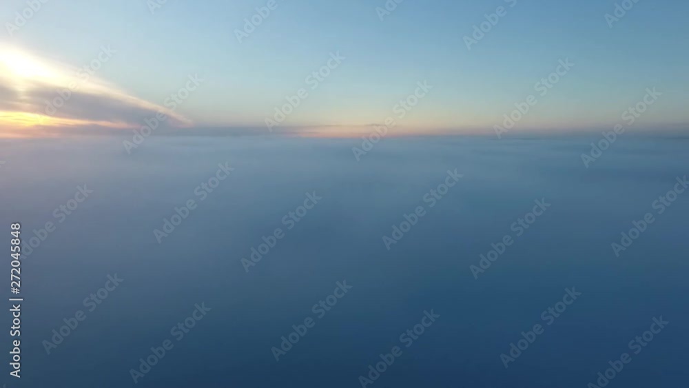 Real Aerial shot, Drone fly in clouds in sunrise nature, camera fly in foggy. Flight over clouds sunrise, ridges and hills in the sunlight of dawn. Real Aerial shot, Drone fly in clouds in sunrise nature, camera fly in foggy. Flight over clouds sunrise, ridges and hills in the sunlight of dawn.