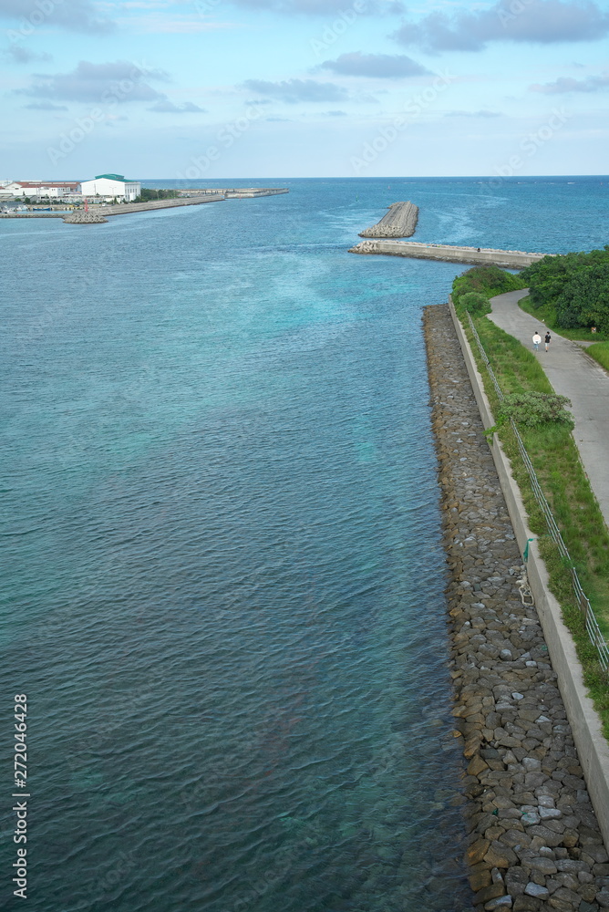 Okinawa,Japan-May 30, 2019: Tonoshiro fishing port or harbor viewed from the southern gate bridge in the afternoon in Ishigaki, Okinawa