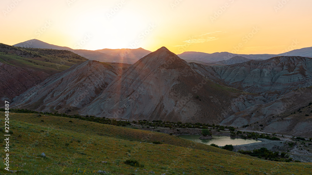 Sunset in the mountains, landscape with lake