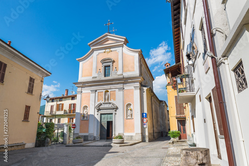 Square in old town. Orino village in north Italy in the Campo dei Fiori regional park, province of Varese. Immaculate Blessed Virgin Parish of Orino (17th century), square 11 February