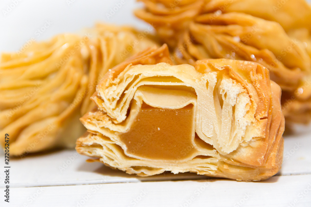 fried pastries with sweet quince and batata typical of Argentine gastronomy fried pastries with sweet quince and batata typical of Argentine gastronomy
