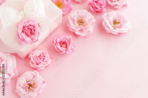 Flowers composition background. beautiful pale pink roses and gift or present box on pale pink    background.Top view.Copy space © irenastar