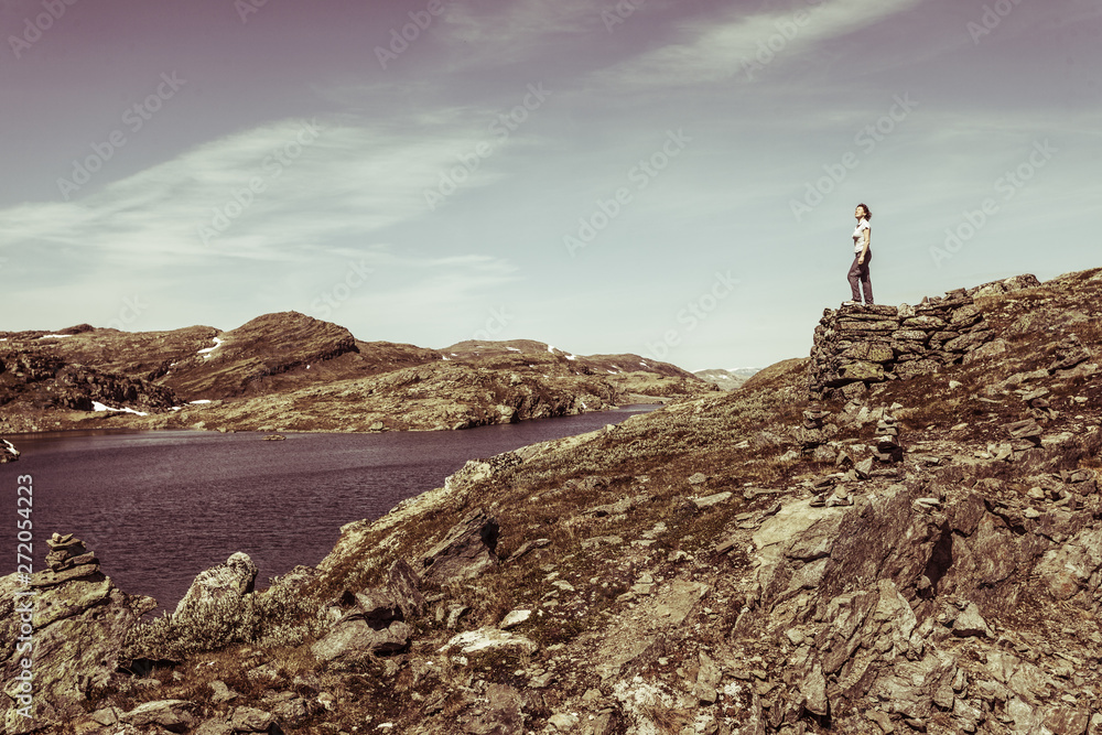Tourist enjoying landscape norwegian nature Tourist enjoying landscape norwegian nature