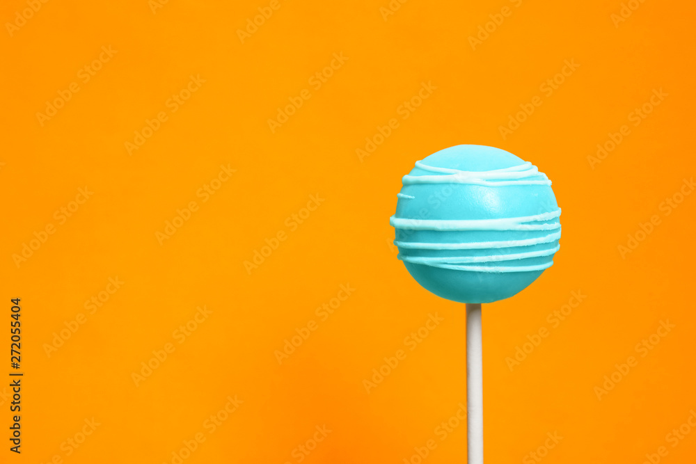 Bright delicious cake pop on color background. Space for text Bright delicious cake pop on color background. Space for text