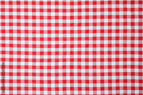 Checkered picnic tablecloth as background, top view