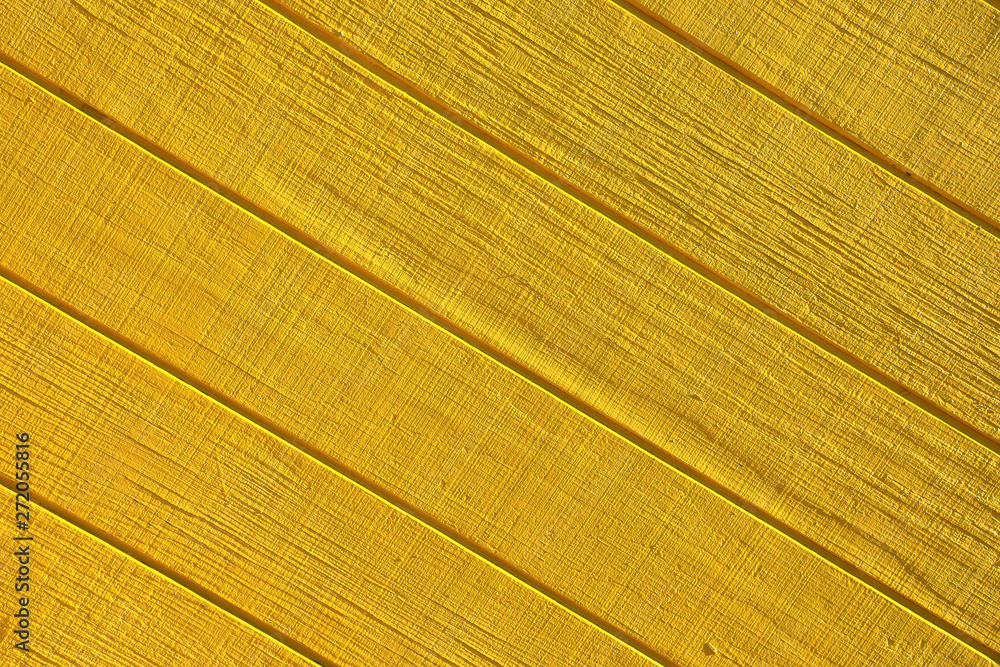 Abstract background image of yellow painted wooden building exterior surface