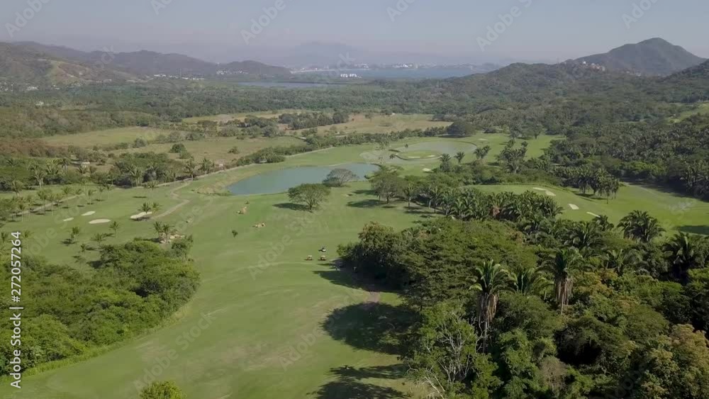 Smooth aerial shot of beautiful landscape in Manzanillo, located in Mexico. Sunny, cloudless day of summer. Smooth aerial shot of beautiful landscape in Manzanillo, located in Mexico. Sunny, cloudless day of summer.