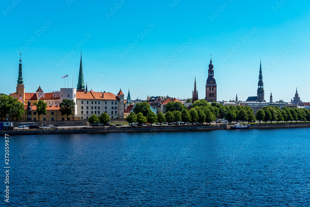 Cityscape of River and Riga Latvia on a Clear Sunny Day Cityscape of River and Riga Latvia on a Clear Sunny Day