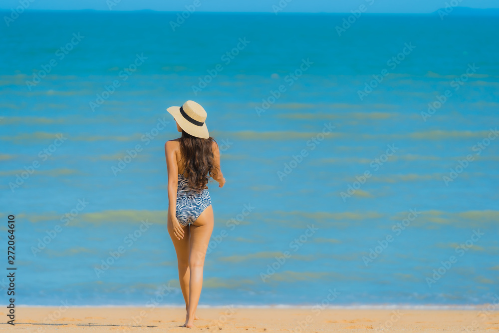 Portrait beautiful young asian woman happy smile relax on the tropical beach sea ocean for leisure travel Portrait beautiful young asian woman happy smile relax on the tropical beach sea ocean for leisure travel