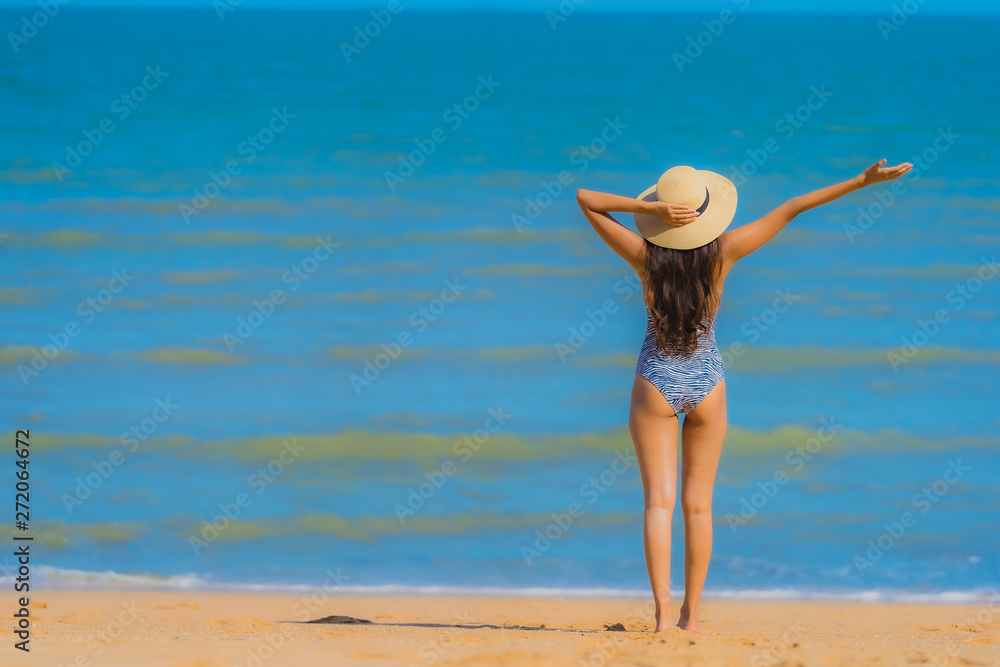 Portrait beautiful young asian woman happy smile relax on the tropical beach sea ocean for leisure travel Portrait beautiful young asian woman happy smile relax on the tropical beach sea ocean for leisure travel